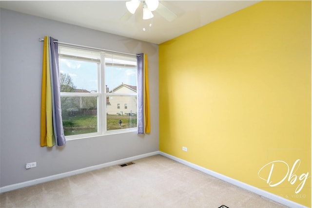 2272 Iroquois Ln, Round Lake Heights, IL 60073 - empty room with ceiling fan, visible vents, plenty of natural light, and light carpet