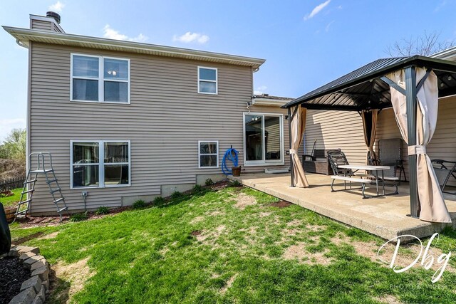 2272 Iroquois Ln, Round Lake Heights, IL 60073 - back of house with a lawn, a gazebo, a chimney, and a patio area