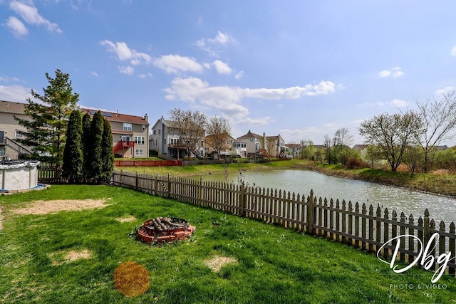 2272 Iroquois Ln, Round Lake Heights, IL 60073 - view of yard featuring fence private yard, a water view, a fire pit, and a residential view