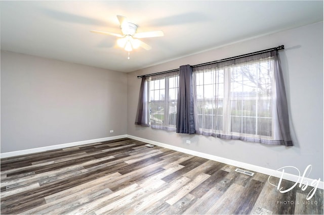 2272 Iroquois Ln, Round Lake Heights, IL 60073 - unfurnished room featuring baseboards, ceiling fan, wood finished floors, and visible vents