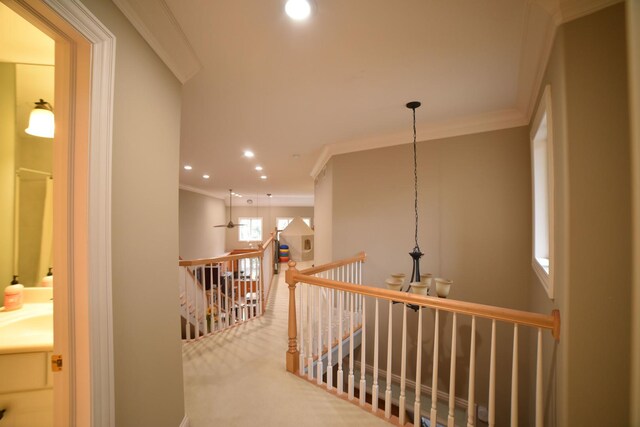 rec room with a chandelier, crown molding, and carpet