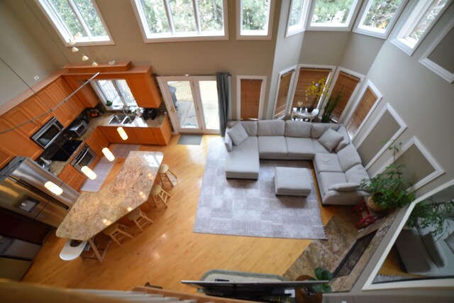 bedroom featuring carpet, multiple windows, multiple closets, high vaulted ceiling, and recessed lighting