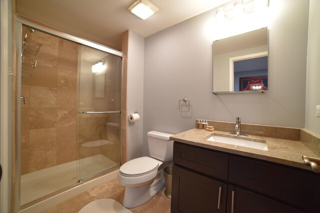 bedroom with wood finished floors, a towering ceiling, ornamental molding, and baseboards