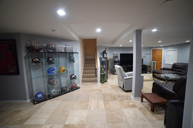kitchen with light stone countertops, recessed lighting, open floor plan, and baseboards