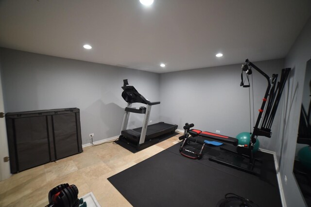 exercise area with recessed lighting and baseboards