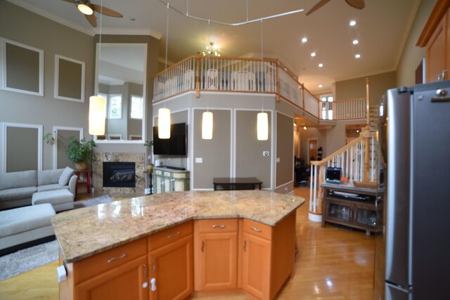 living area featuring high vaulted ceiling, a ceiling fan, stairway, a high end fireplace, and recessed lighting