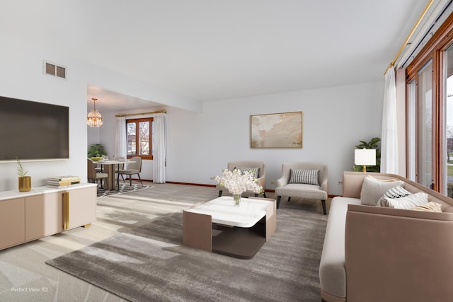 16921 84th Ave, Tinley Park, IL 60477 - living room featuring a chandelier, light colored carpet, and baseboards
