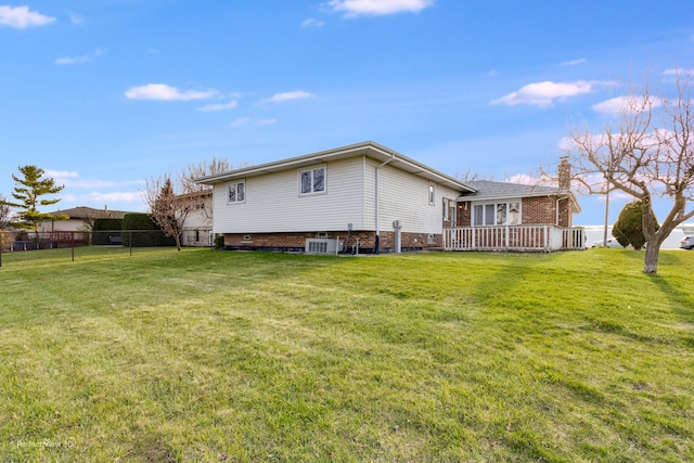 16921 84th Ave, Tinley Park, IL 60477 - rear view of house with brick siding, a wooden deck, cooling unit, and a chimney