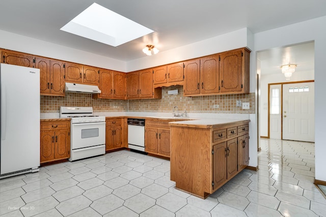 16921 84th Ave, Tinley Park, IL 60477 - kitchen with white appliances, under cabinet range hood, a skylight, and brown cabinets
