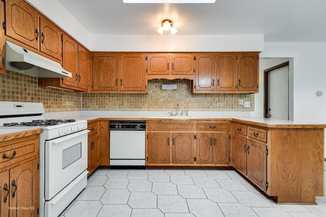 16921 84th Ave, Tinley Park, IL 60477 - kitchen with white appliances, under cabinet range hood, a peninsula, a sink, and tasteful backsplash