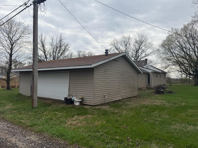 1605 14th Ave, Rock Falls, IL 61071 - view of property exterior with a detached garage, an outbuilding, and a yard