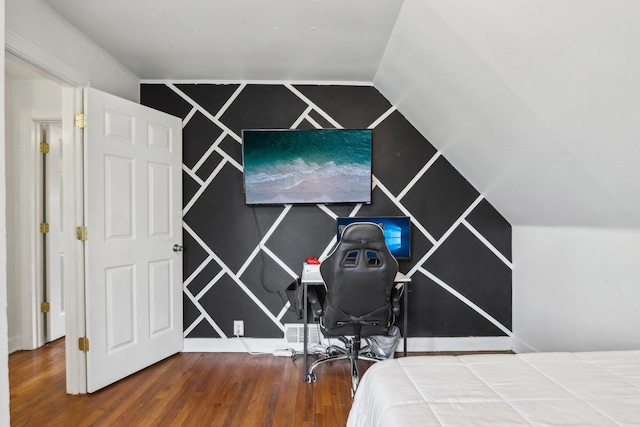 bedroom with wood finished floors