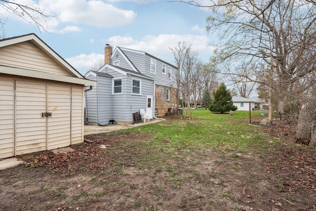 view of yard with an outdoor structure and a storage unit