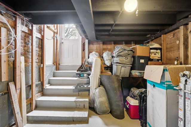 basement featuring stairs