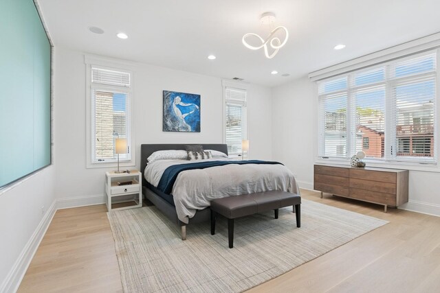 1431 N Mohawk St, Chicago, IL 60610 - bedroom featuring light wood finished floors, baseboards, a chandelier, and recessed lighting