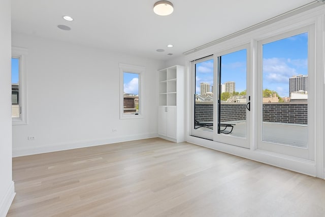 1431 N Mohawk St, Chicago, IL 60610 - unfurnished room featuring light wood-style floors, baseboards, and recessed lighting
