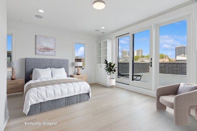 1431 N Mohawk St, Chicago, IL 60610 - bedroom featuring light wood finished floors, access to exterior, baseboards, and recessed lighting