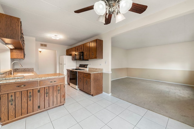 9810 Mill Dr W Unit 1B, Palos Park, IL 60464 - kitchen with a ceiling fan, black microwave, light colored carpet, gas range oven, and visible vents