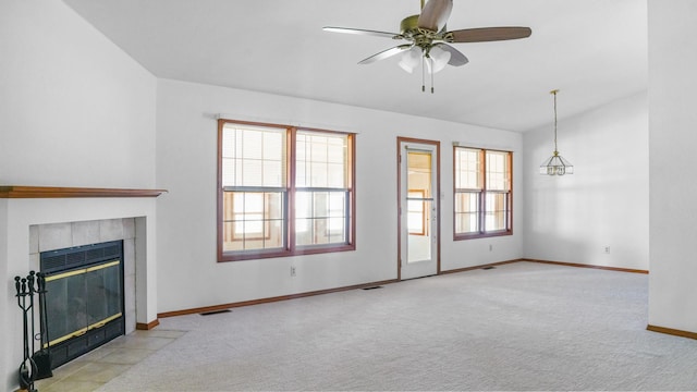 821 Park Dr, Rantoul, IL 61866 - unfurnished living room with carpet, a fireplace, baseboards, a ceiling fan, and lofted ceiling