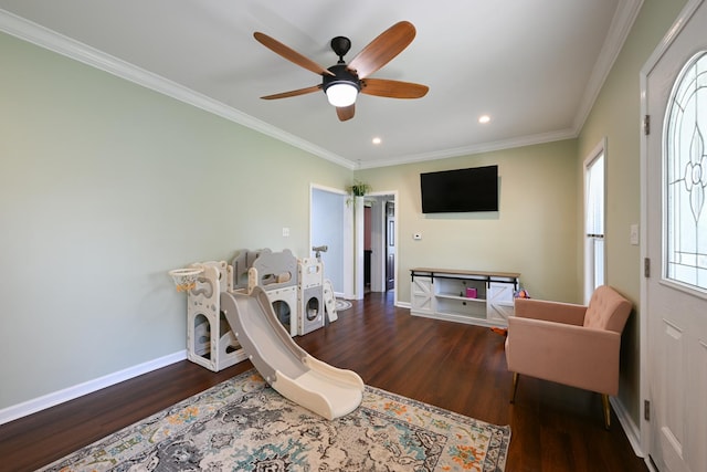 sitting room featuring ceiling fan, crown molding, wood finished floors, baseboards, and recessed lighting