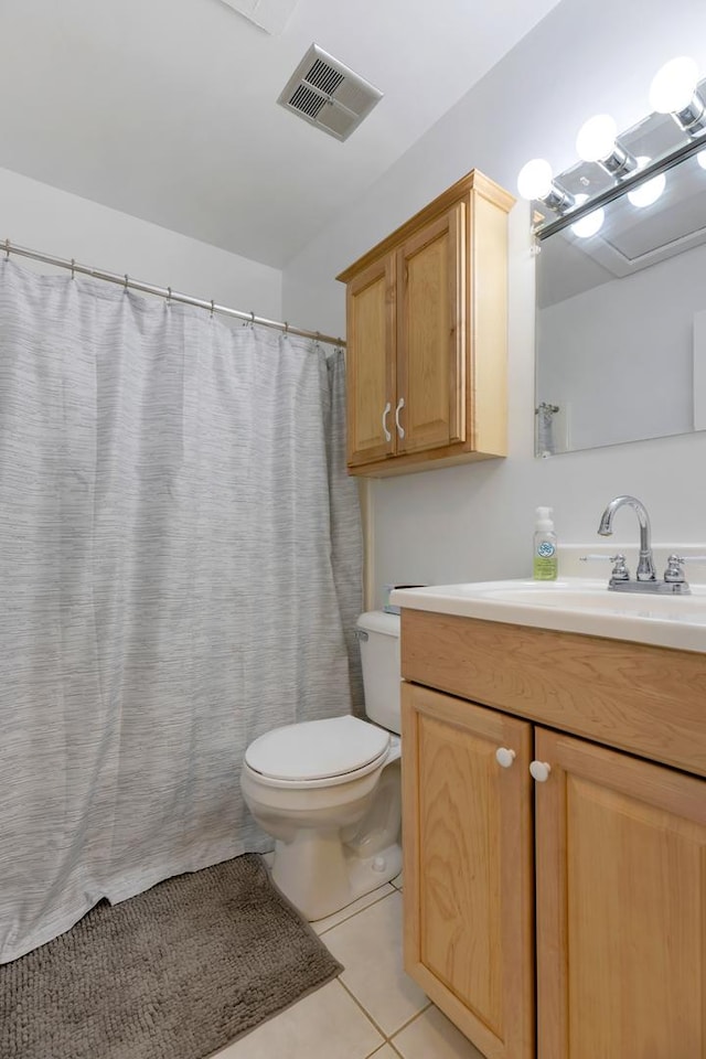 28 Jamaica Colony Unit 5, Fox Lake, IL 60020 - bathroom with vanity, toilet, and tile patterned flooring