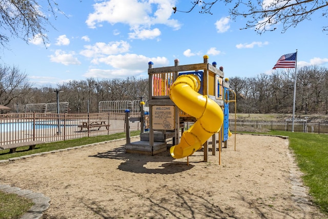 28 Jamaica Colony Unit 5, Fox Lake, IL 60020 - communal playground featuring a community pool and view of wooded area