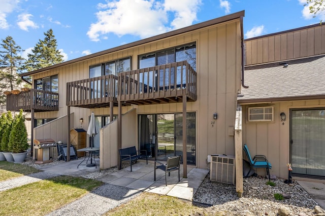 28 Jamaica Colony Unit 5, Fox Lake, IL 60020 - rear view of house with a patio area and a shingled roof