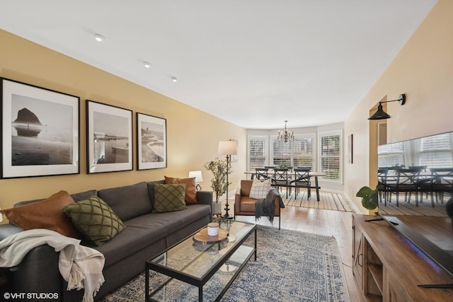 2828 Ashton Ct, Westchester, IL 60154 - living room featuring an inviting chandelier and light wood finished floors