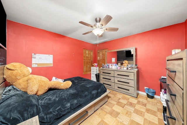 bedroom featuring baseboards and a ceiling fan