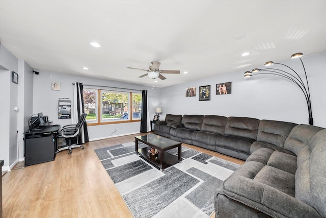 living room featuring wood finished floors, ceiling fan, recessed lighting, an office area, and baseboards