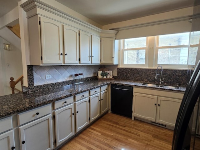 7324 W Lunt Ave, Chicago, IL 60631 - kitchen featuring black dishwasher, light wood-style floors, backsplash, and a sink