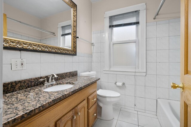 7324 W Lunt Ave, Chicago, IL 60631 - bathroom featuring tile walls, a wealth of natural light, toilet, and vanity