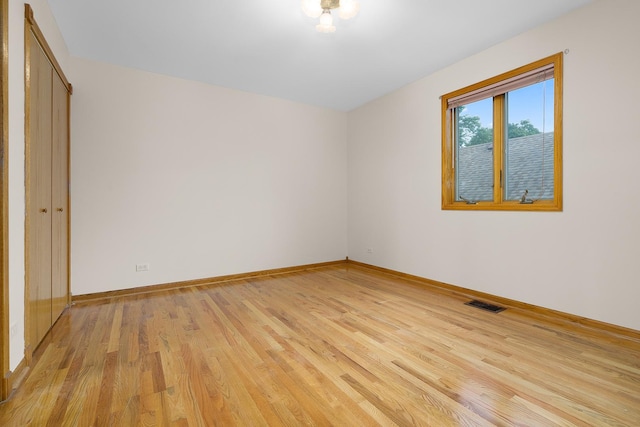 7324 W Lunt Ave, Chicago, IL 60631 - unfurnished bedroom with a closet, light wood-style flooring, visible vents, and baseboards