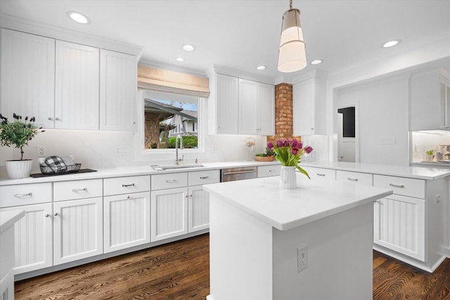 kitchen with dark wood-type flooring, recessed lighting, white cabinets, tasteful backsplash, and a sink
