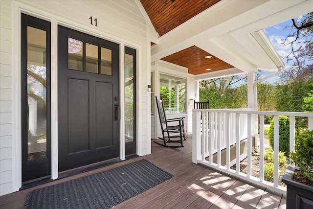 property entrance with covered porch