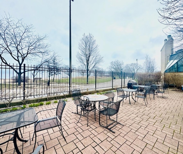 view of patio / terrace featuring fence