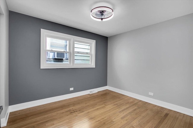 314 W 106th Pl, Chicago, IL 60628 - unfurnished room with light wood-style floors and baseboards