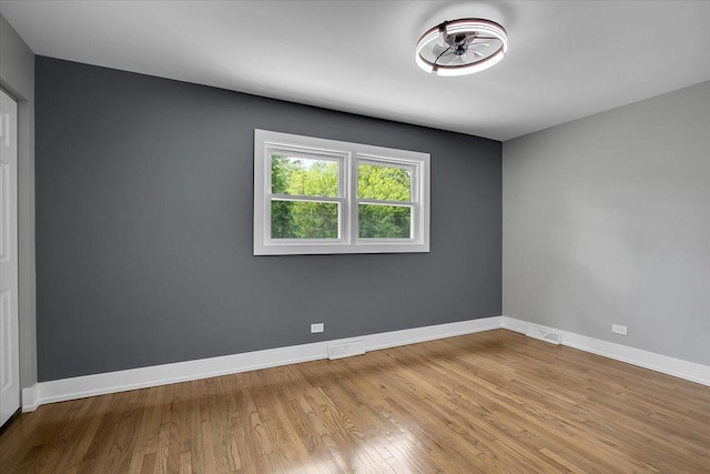 314 W 106th Pl, Chicago, IL 60628 - empty room with wood finished floors and baseboards