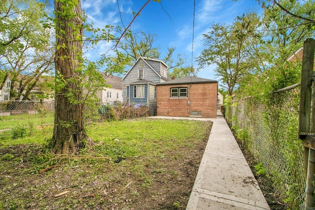 314 W 106th Pl, Chicago, IL 60628 - view of front of house with a fenced backyard and brick siding