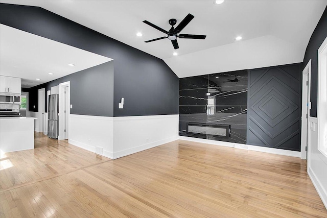 314 W 106th Pl, Chicago, IL 60628 - unfurnished living room with lofted ceiling, a ceiling fan, light wood-style flooring, and recessed lighting