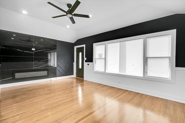 314 W 106th Pl, Chicago, IL 60628 - unfurnished living room featuring lofted ceiling, ceiling fan, wood finished floors, and baseboards