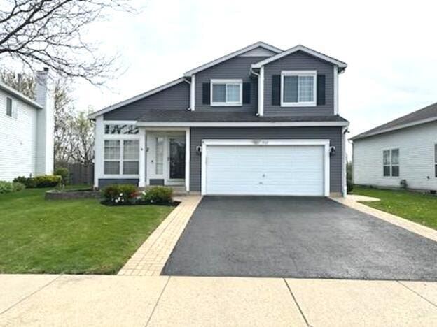 view of front of home with an attached garage and driveway