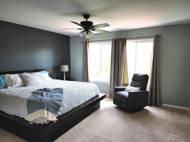 stairway featuring baseboards, a chandelier, and carpet