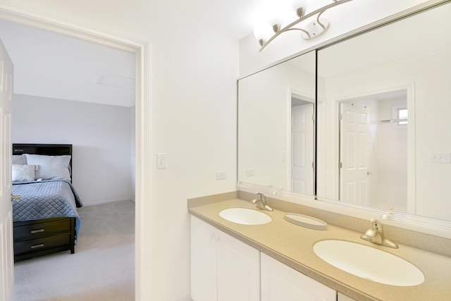 full bathroom with double vanity, ensuite bath, and a sink