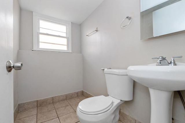742 Newell Ave, Calumet City, IL 60409 - half bathroom featuring tile patterned floors, toilet, and a sink