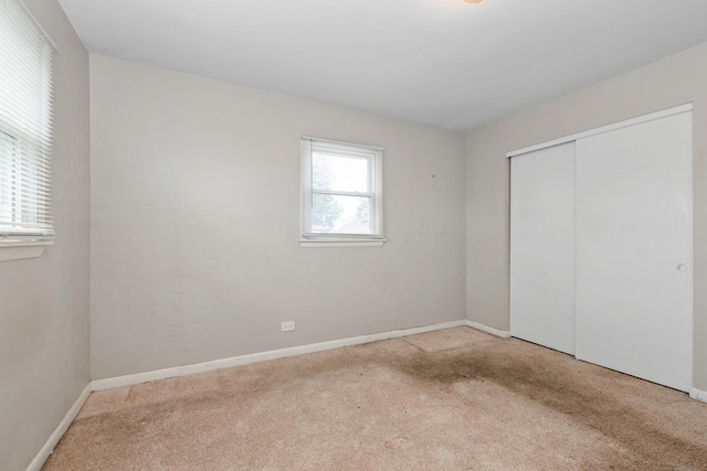742 Newell Ave, Calumet City, IL 60409 - unfurnished bedroom featuring a closet, carpet flooring, and baseboards