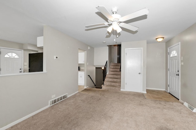 742 Newell Ave, Calumet City, IL 60409 - unfurnished living room featuring visible vents, ceiling fan, carpet floors, and baseboards