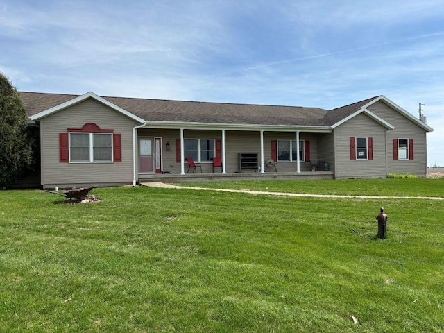 ranch-style home featuring a front yard and covered porch