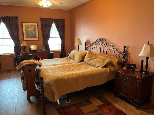 bedroom featuring hardwood / wood-style floors and ceiling fan