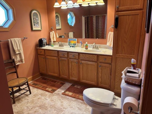 full bath with toilet, a shower with curtain, a sink, and double vanity